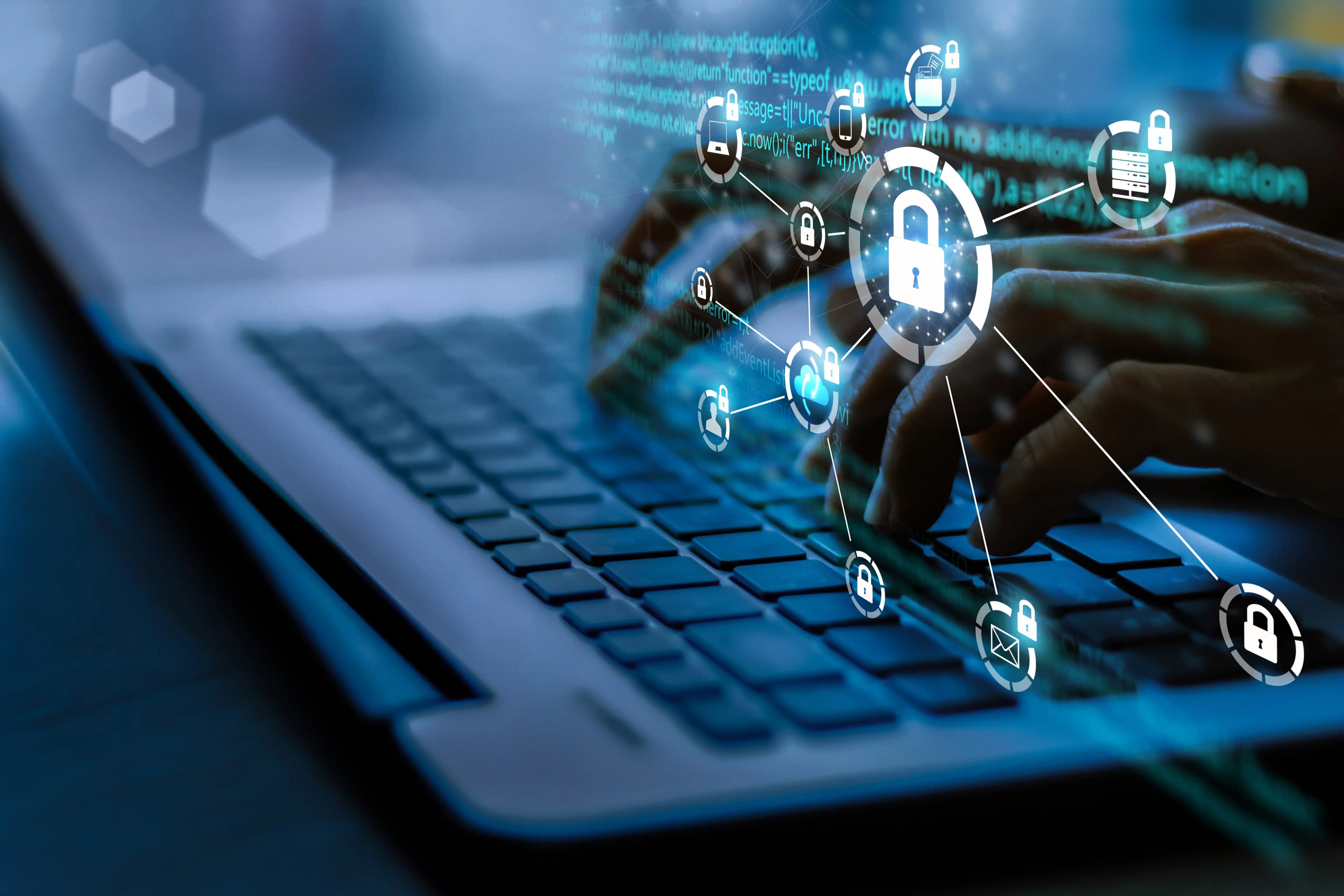 Person typing on a laptop with security icons popping up